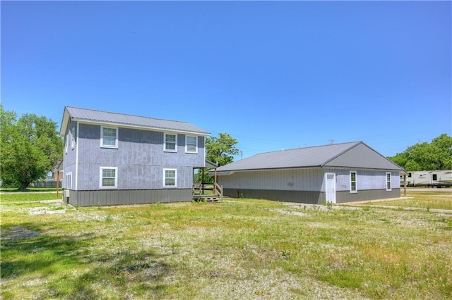 511 N E Ave, Columbus, KS 66725 - rear view of house with metal roof