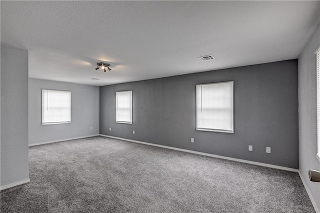 511 N E Ave, Columbus, KS 66725 - carpeted spare room featuring baseboards
