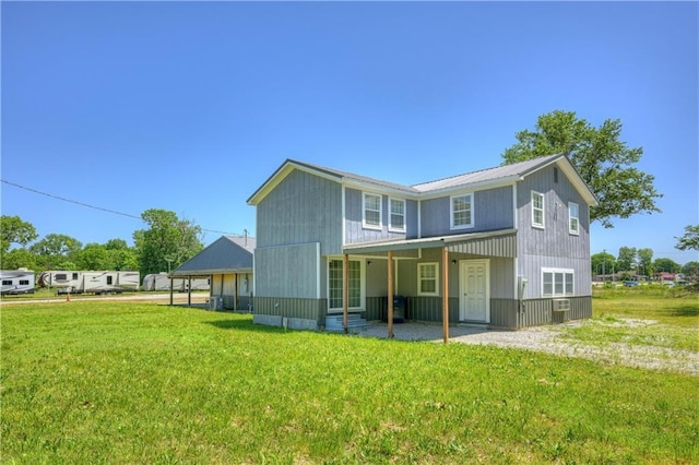 511 N E Ave, Columbus, KS 66725 - view of front facade with a front yard