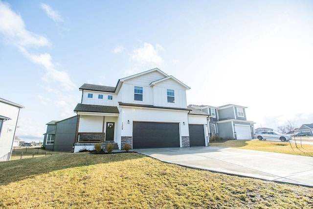 view of front facade with concrete driveway, a front yard, fence, a garage, and stone siding