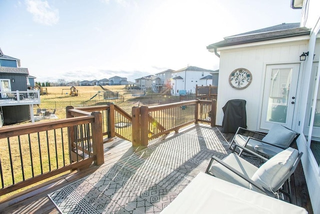 deck featuring a residential view and a yard