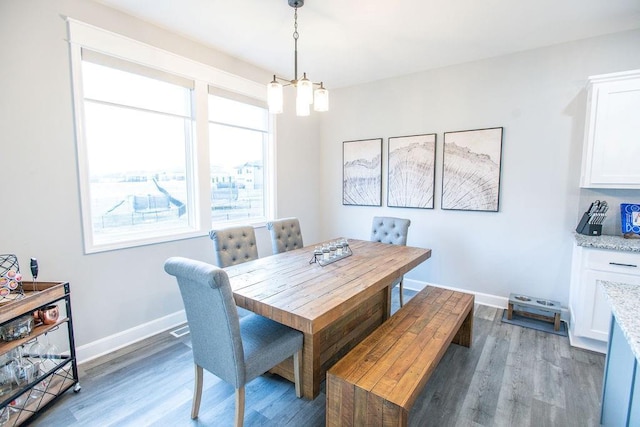 dining room with wood finished floors and baseboards