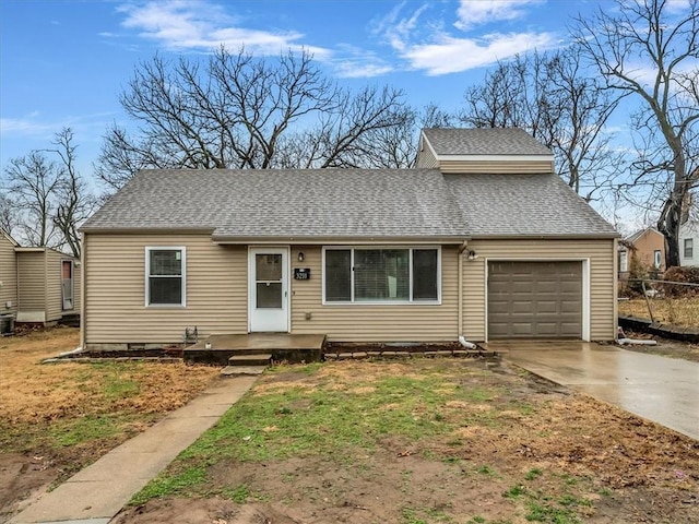 view of front of property with an attached garage, a shingled roof, fence, and concrete driveway