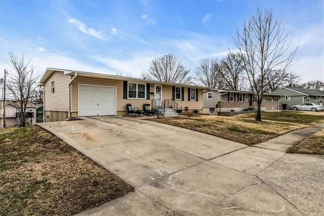 single story home featuring concrete driveway and an attached garage