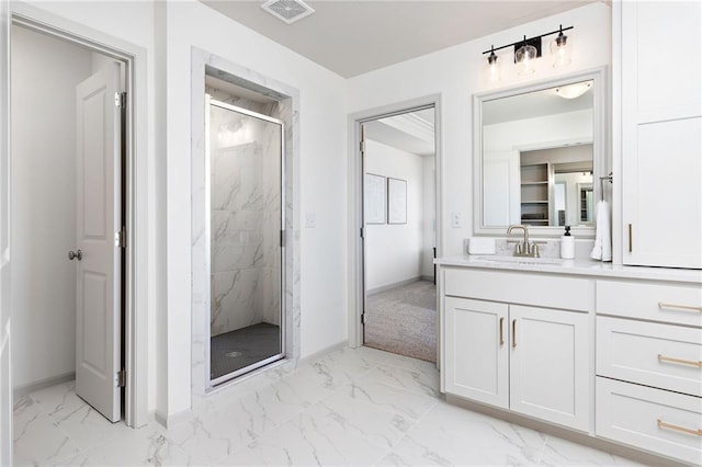 full bath with marble finish floor, a marble finish shower, visible vents, and vanity