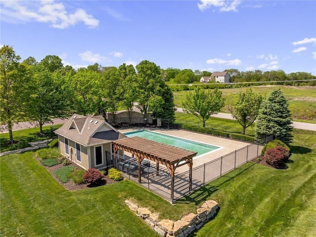 view of pool with a lawn and a fenced in pool