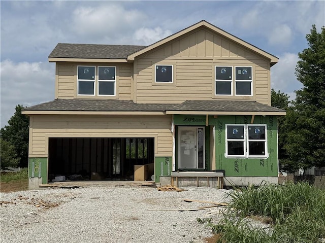 19520 W 208th St, Spring Hill, KS 66083 - view of front of home with a shingled roof, driveway, an attached garage, and board and batten siding