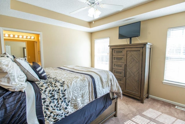 bedroom with visible vents, multiple windows, baseboards, and carpet floors