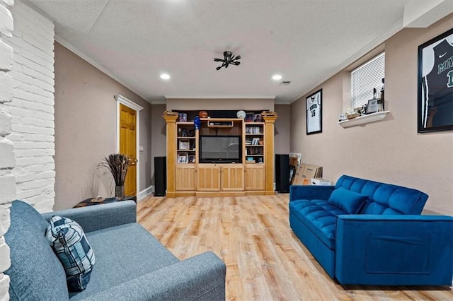 3820 Virginia Ave, Kansas City, MO 64109 - living area featuring recessed lighting, ornamental molding, and wood finished floors