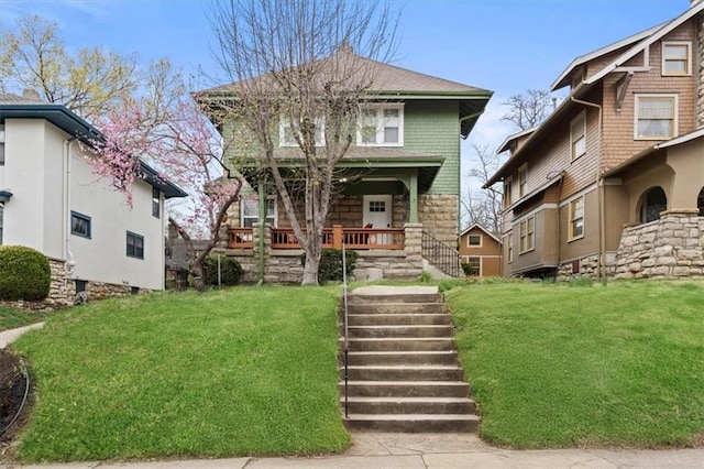 3820 Virginia Ave, Kansas City, MO 64109 - traditional style home featuring a front lawn, covered porch, and stone siding