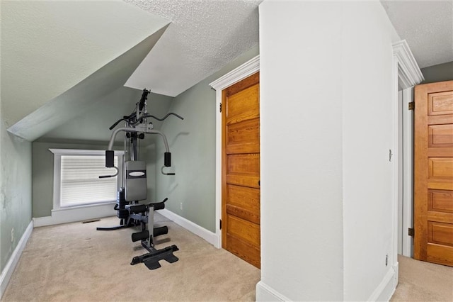 3820 Virginia Ave, Kansas City, MO 64109 - exercise area with carpet floors, a textured ceiling, and baseboards