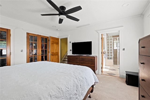3820 Virginia Ave, Kansas City, MO 64109 - bedroom featuring french doors, crown molding, light colored carpet, a ceiling fan, and ensuite bath