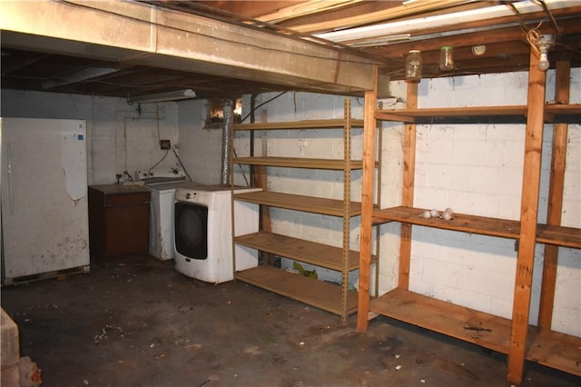 unfinished below grade area featuring separate washer and dryer