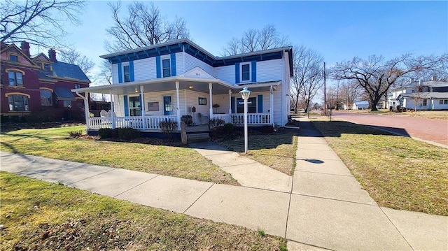 view of front of home featuring a porch and a front lawn