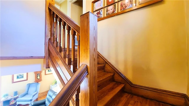 stairs with wood finished floors