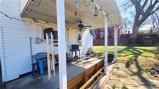 view of patio with a ceiling fan and fence