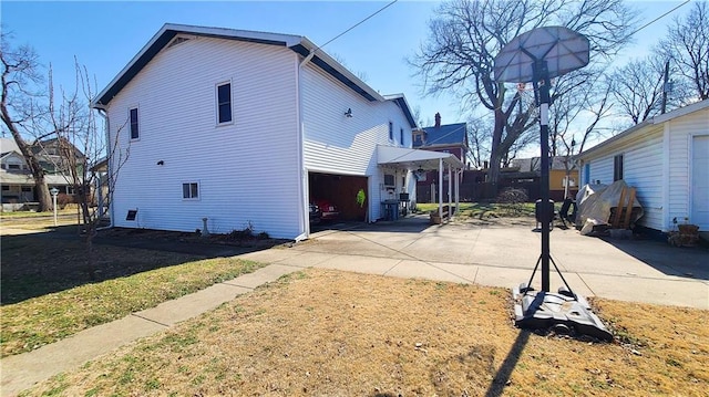 view of home's exterior featuring driveway