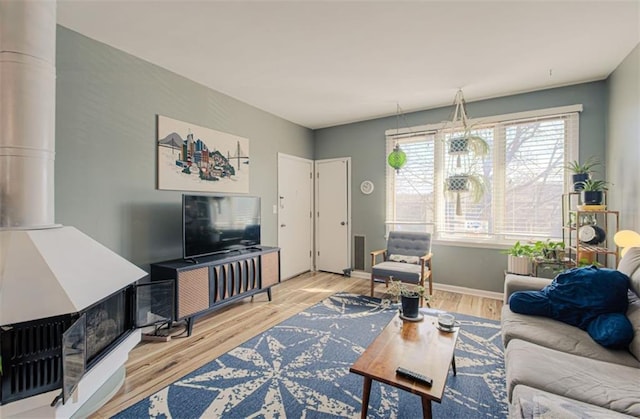 living room with wood finished floors and baseboards