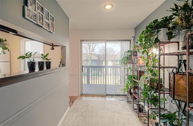 doorway to outside featuring wood finished floors