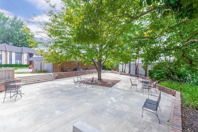 view of patio featuring fence