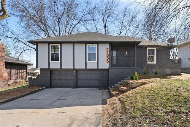 view of front of home featuring brick siding, roof with shingles, concrete driveway, and an attached garage