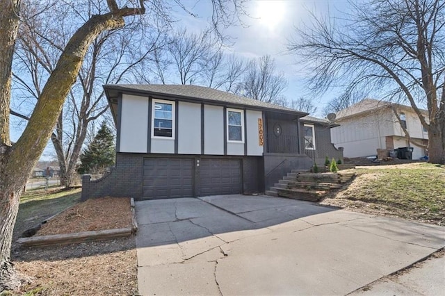 view of front of property with concrete driveway, an attached garage, and brick siding