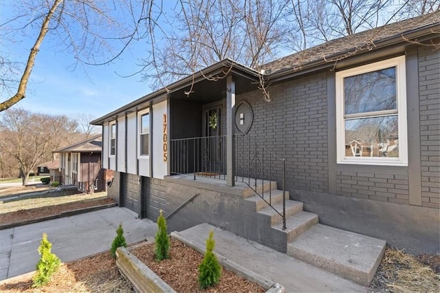 exterior space with brick siding