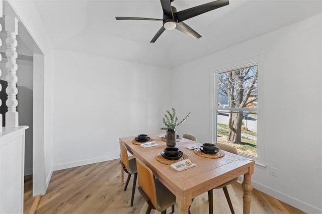 dining area featuring baseboards, light wood finished floors, and ceiling fan