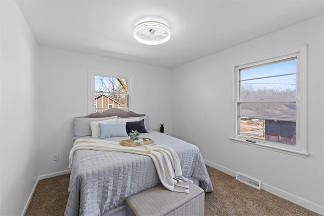 bedroom with carpet, baseboards, and visible vents