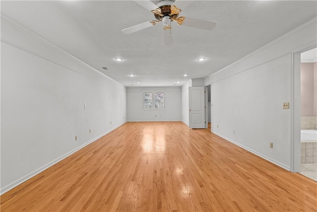 empty room featuring recessed lighting, light wood-style floors, crown molding, and ceiling fan