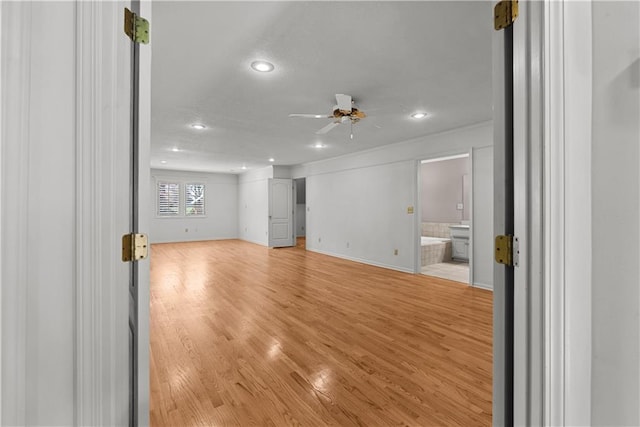 unfurnished living room with light wood finished floors, baseboards, a ceiling fan, and recessed lighting