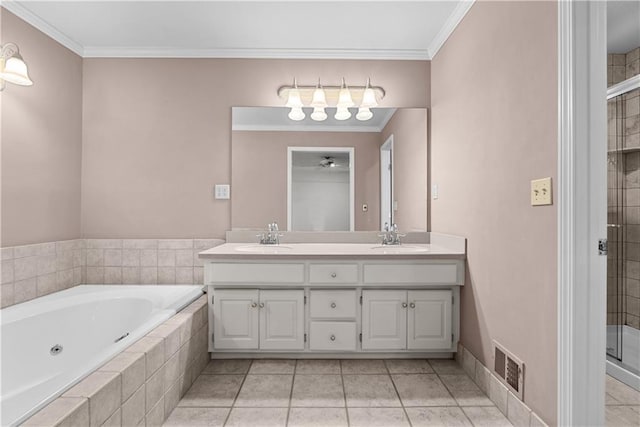 bathroom featuring a shower stall, double vanity, a sink, and visible vents