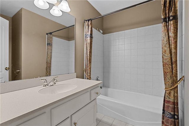 bathroom with tile patterned floors, shower / bathtub combination with curtain, and vanity