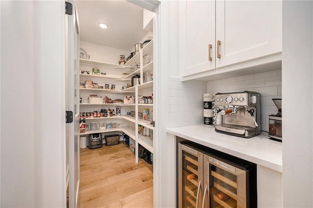 storage area featuring wine cooler