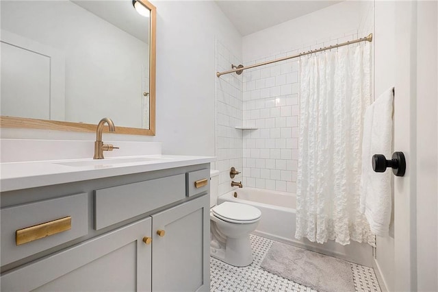 full bathroom with shower / tub combo, tile patterned flooring, vanity, and toilet