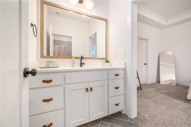 bathroom featuring crown molding and vanity