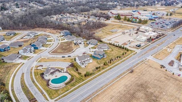 birds eye view of property with a residential view