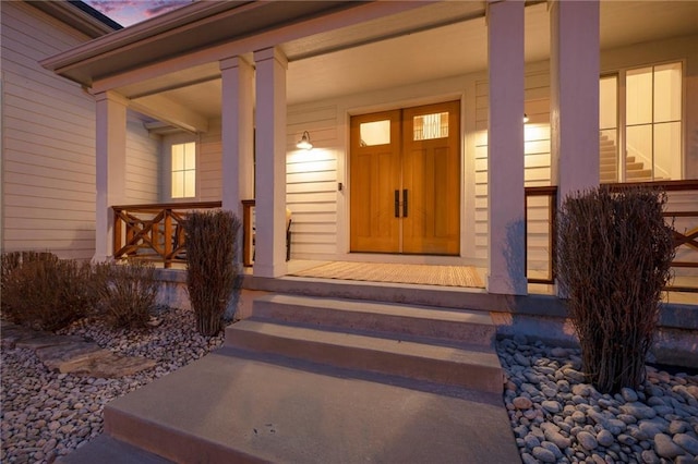 exterior entry at dusk with a porch