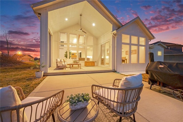 back of property featuring a patio area and an outdoor hangout area