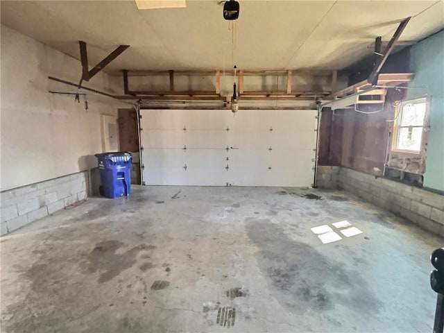 garage with concrete block wall