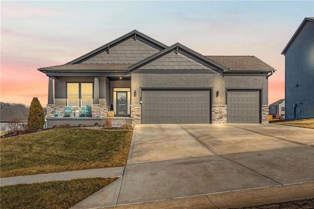 craftsman house with stucco siding, covered porch, concrete driveway, a garage, and stone siding