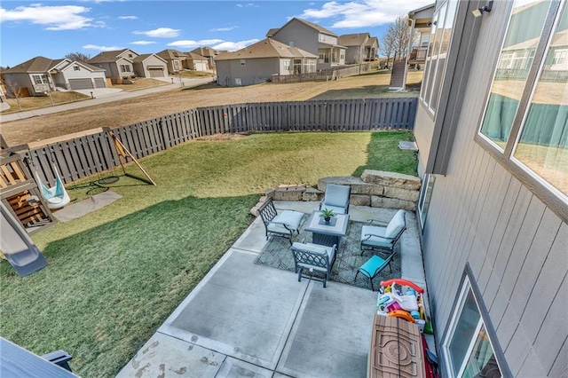 view of patio with a fenced backyard and a residential view