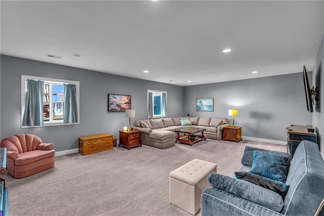 carpeted living room featuring recessed lighting, visible vents, and baseboards