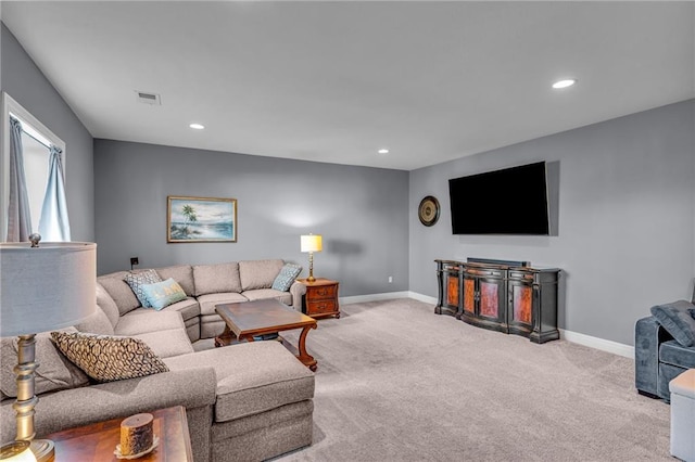 carpeted living room with recessed lighting, visible vents, and baseboards