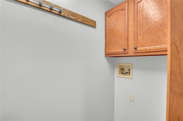 laundry room with hookup for a washing machine and cabinet space