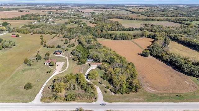 birds eye view of property featuring a rural view