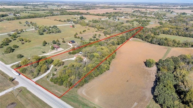 birds eye view of property featuring a rural view