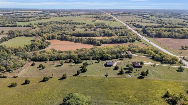 birds eye view of property featuring a rural view