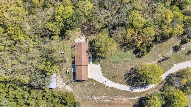 bird's eye view with a wooded view