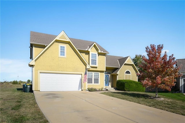 traditional-style home with a garage, a front yard, driveway, and stucco siding